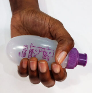 Female hand with pocket bottle